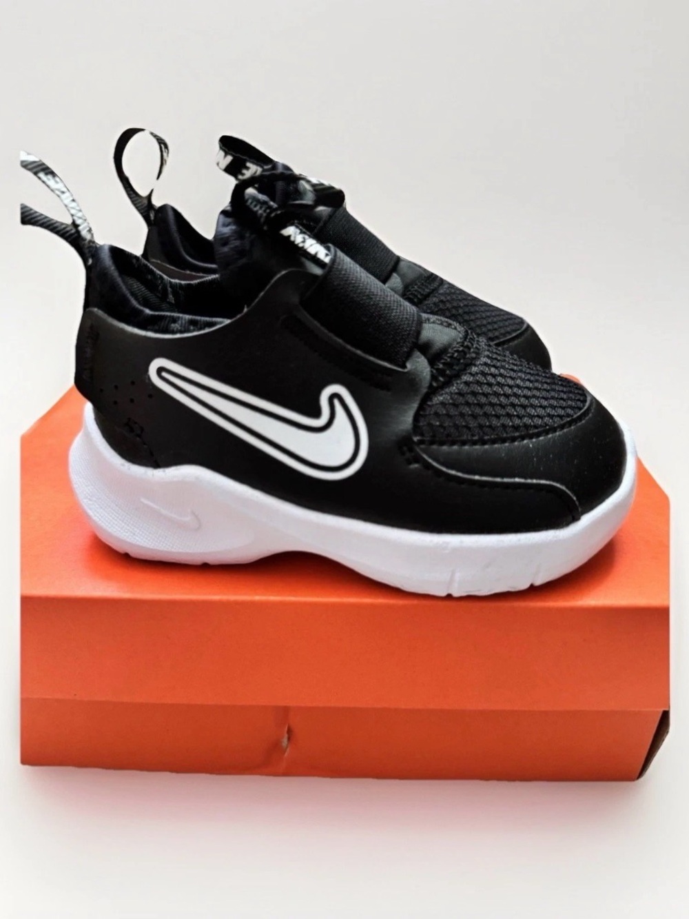Nike Kids Black and White Slip-On Sneakers